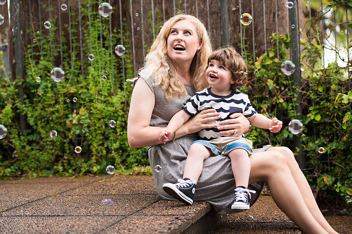 family photographer - outdoor family portrait with bubbles