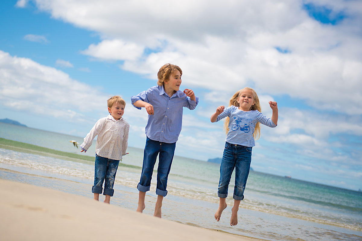 children photos on the beach one tree point nz