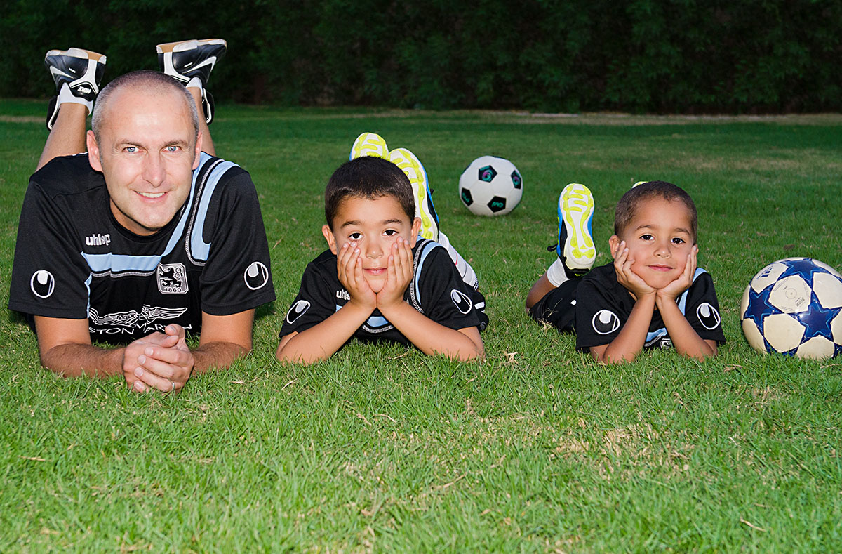 family portrait in soccer outfits by angelika thorn photgraphy