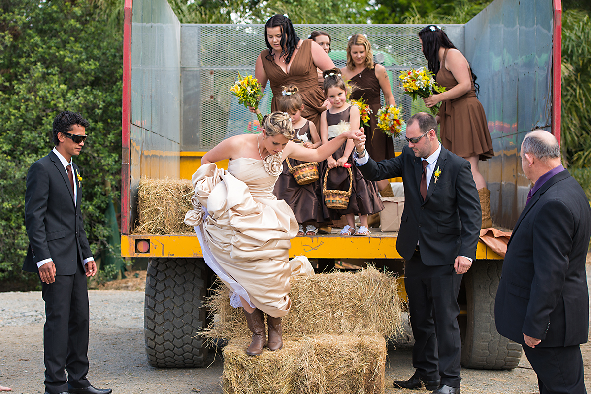 bridal party arrived on wedding ceremony on a truck. Authentic wedding photgraphy, NZ